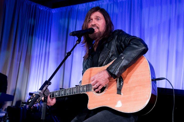 Billy Ray Cyrus performs onstage at the Celebrity Fight Night's Founders Club Dinner Billy Ray Cyrus performs onstage at the Celebrity Fight Night's Founders Club Dinner