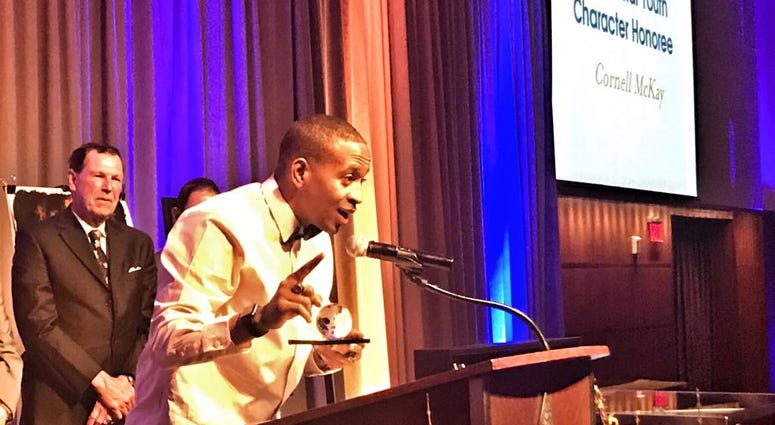 Cornell McKay receiving the Stan Musial Youth Character Award Cornell McKay receiving the Stan Musial Youth Character Award
