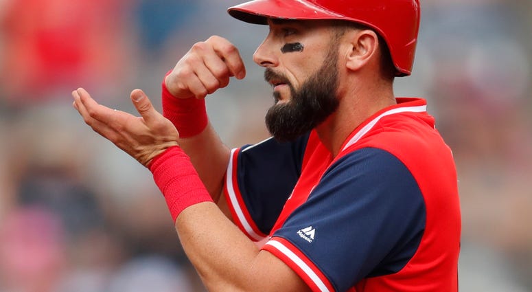 St. Louis Cardinals' Matt Carpenter gestures to the dugout St. Louis Cardinals' Matt Carpenter gestures to the dugout