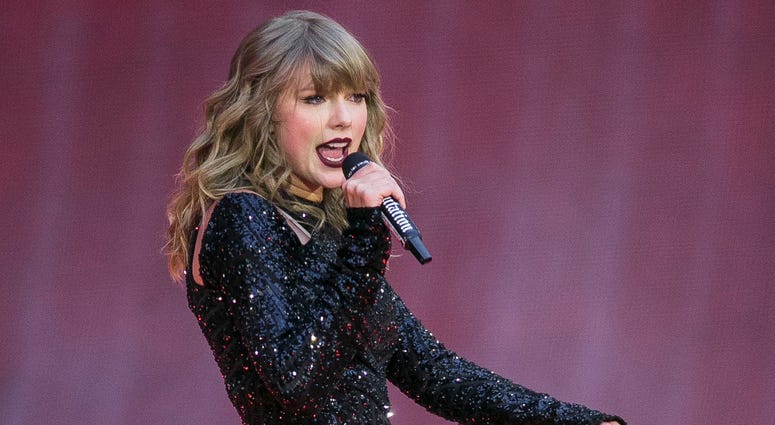 FILE - In this June 22, 2018, file photo, singer Taylor Swift performs on stage in concert at Wembley Stadium in London.