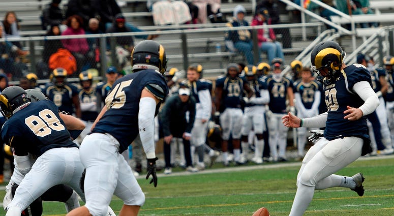 Shepherd University kicker Ruan Venter drop kicks and extra point during a college football game Shepherd University kicker Ruan Venter drop kicks and extra point during a college football game