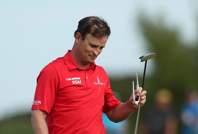 Zach Johnson walks after hitting for an eagle on the 6th hole during the third round of the British Open Golf Championship Zach Johnson walks after hitting for an eagle on the 6th hole during the third round of the British Open Golf Championship