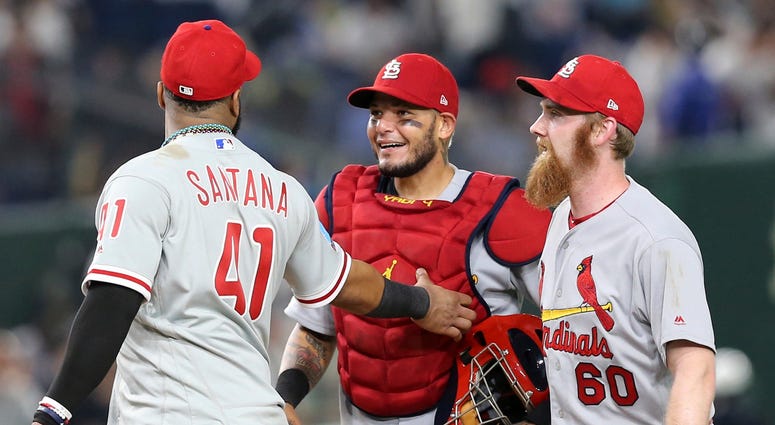 MLB All-Star catcher Yadier Molina, center, of the St. Louis Cardinals celebrates with closer John Brebbia (60) of the St. Louis Cardinals MLB All-Star catcher Yadier Molina, center, of the St. Louis Cardinals celebrates with closer John Brebbia (60) of the St. Louis Cardinals