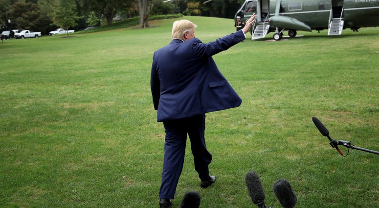 U.S. President Donald Trump waves while departing the White House on October 03, 2019 in Washington, DC.