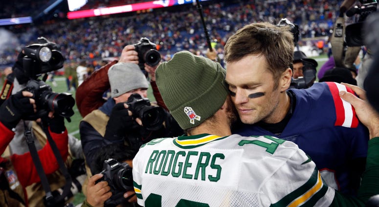 Green Bay Packers quarterback Aaron Rodgers (12) greets New England Patriots quarterback Tom Brady Green Bay Packers quarterback Aaron Rodgers (12) greets New England Patriots quarterback Tom Brady