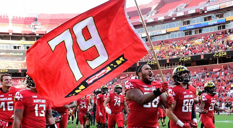 Maryland Terrapins offensive lineman Ellis McKennie (68) runs onto the field with his teammates holding a flag in remembrance of Jordan McNair Maryland Terrapins offensive lineman Ellis McKennie (68) runs onto the field with his teammates holding a flag in remembrance of Jordan McNair