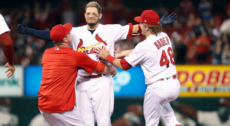 Yadier Molina is congratulated by teammates Jedd Gyorko, left, and Harrison Bader after hitting a walk-off single Yadier Molina is congratulated by teammates Jedd Gyorko, left, and Harrison Bader after hitting a walk-off single