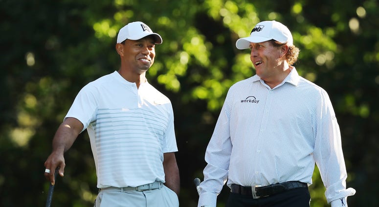 Tiger Woods and Phil Mickelson share a laugh on the 11th tee while playing a practice round for the 2018 Masters Tiger Woods and Phil Mickelson share a laugh on the 11th tee while playing a practice round for the 2018 Masters