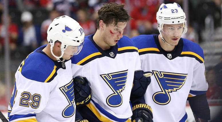 St. Louis Blues center Oskar Sundqvist (70) is helped off the ice after a check by Washington Capitals right wing Tom Wilson St. Louis Blues center Oskar Sundqvist (70) is helped off the ice after a check by Washington Capitals right wing Tom Wilson