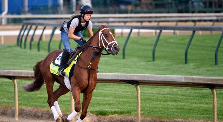 Exercise rider Adele Bellinger works out Kentucky Derby entry Vino Rosso at Churchill. Exercise rider Adele Bellinger works out Kentucky Derby entry Vino Rosso at Churchill.