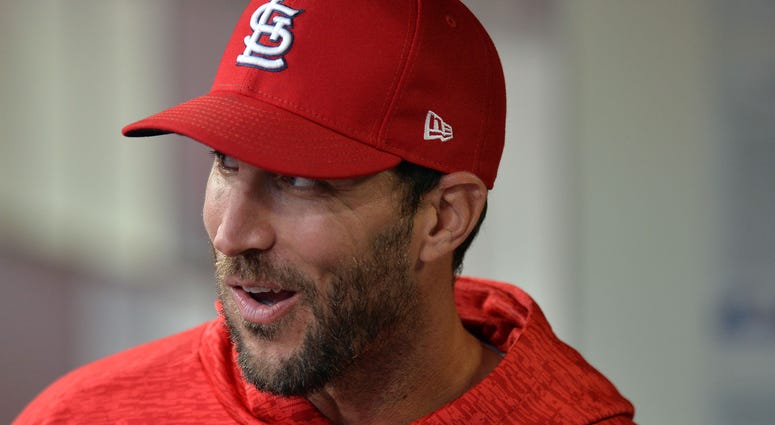 St. Louis Cardinals starting pitcher Adam Wainwright smiles in dugout. St. Louis Cardinals starting pitcher Adam Wainwright smiles in dugout.