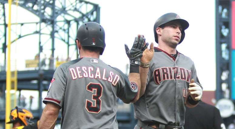 Arizona Diamondbacks second baseman Daniel Descalso (3) greets first baseman Paul Goldschmidt Arizona Diamondbacks second baseman Daniel Descalso (3) greets first baseman Paul Goldschmidt