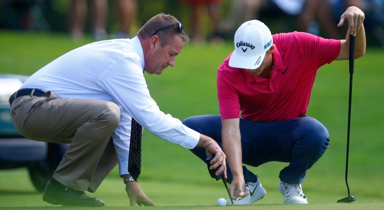 Aaron Wise gets a ruling from the official on the fifth hole during the second round of the Tour Championship Aaron Wise gets a ruling from the official on the fifth hole during the second round of the Tour Championship