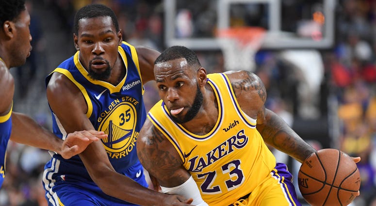 Los Angeles Lakers forward LeBron James (23) dribbles during the first half against the Golden State Warriors Los Angeles Lakers forward LeBron James (23) dribbles during the first half against the Golden State Warriors