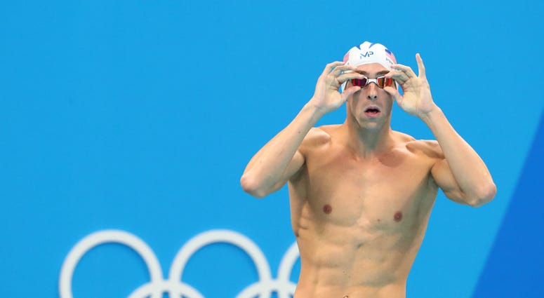 Michael Phelps (USA) during the men's 100m butterfly heats Michael Phelps (USA) during the men's 100m butterfly heats