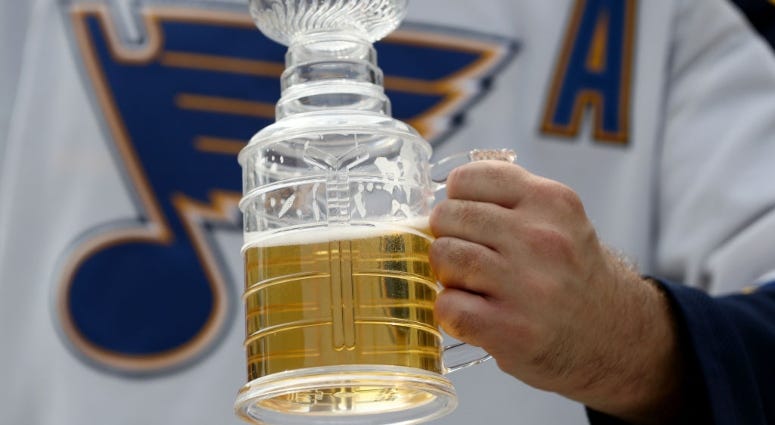 St. Louis Blues fan drinking beer at Stanley Cup Final watch party