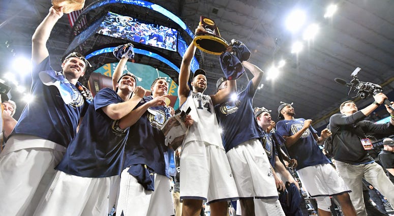 Villanova Wildcats forward Omari Spellman (14) hoist the national championship trophy Villanova Wildcats forward Omari Spellman (14) hoist the national championship trophy