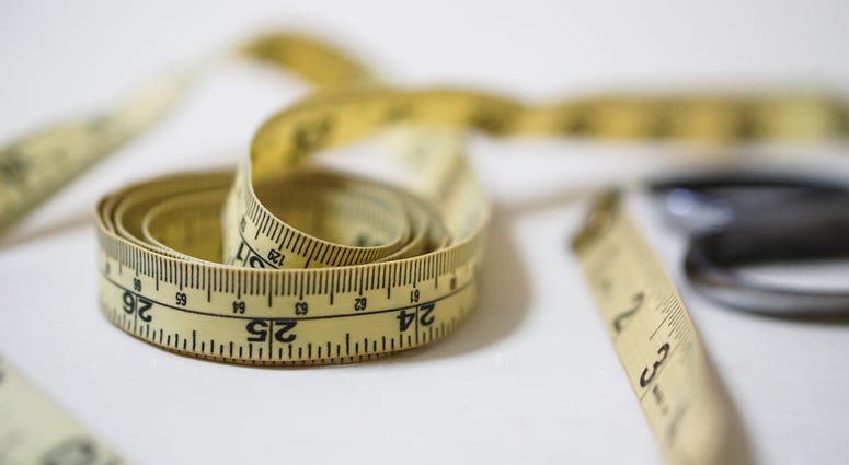 Photo of a tape measure. Photo of a tape measure.