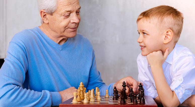 Man mentoring young boy