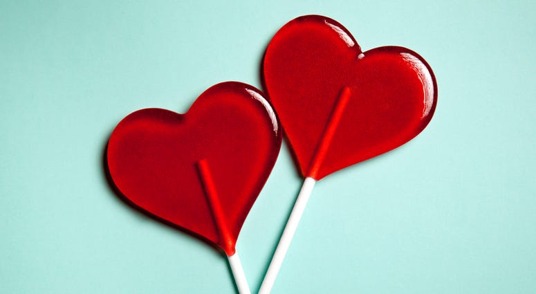 Two lollipops. Red hearts. Candy. Love concept. Valentine day.