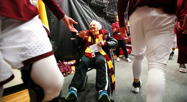 Loyola Ramblers team chaplain, Sister Jean Dolores Schmidt, 98, high fives Loyola players, Loyola Ramblers team chaplain, Sister Jean Dolores Schmidt, 98, high fives Loyola players,
