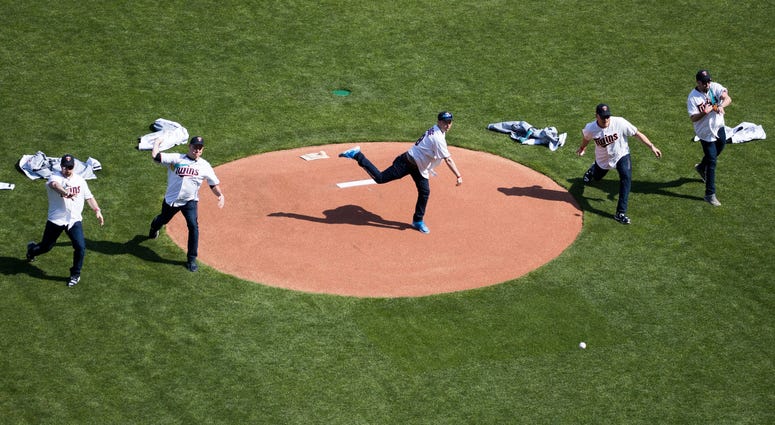 The gold-medal winning USA men's curling team throws out ceremonial first pitches before the Minnesota Twins' home opener .jpg The gold-medal winning USA men's curling team throws out ceremonial first pitches before the Minnesota Twins' home opener .jpg