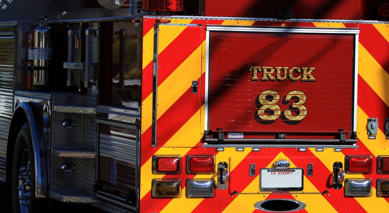 Rear of fire truck in red and yellow.