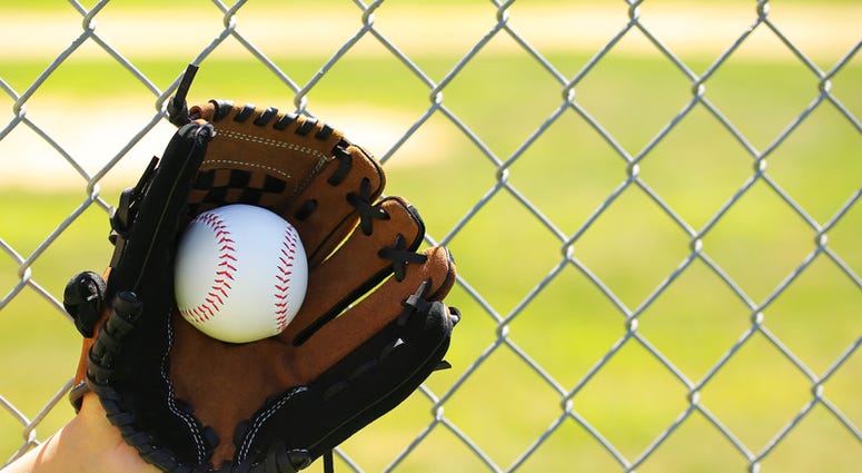 baseball, kids Hand of Baseball Player with Glove and Ball over Field