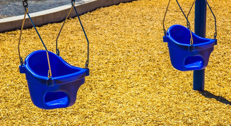Baby swings on playground Baby swings on playground