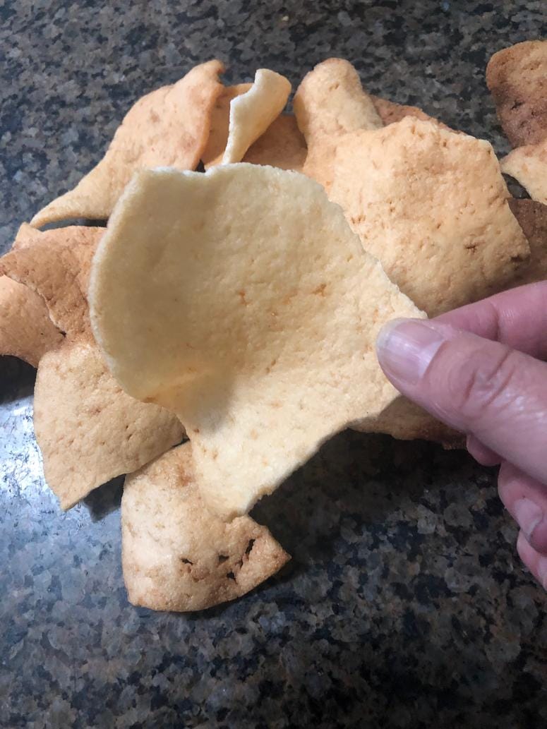 This is what krupuk udang looks like when it's fried. The chips are usually bigger but my son broke them up to get them in a jar. krupuk udang komodo shrimp chips comfort food family favorite