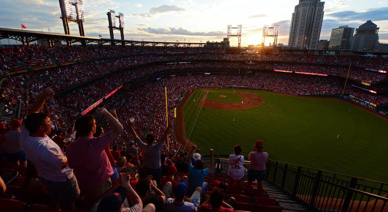 Fans celebrate as the sun sets after a solo home run by St. Louis Cardinals Fans celebrate as the sun sets after a solo home run by St. Louis Cardinals