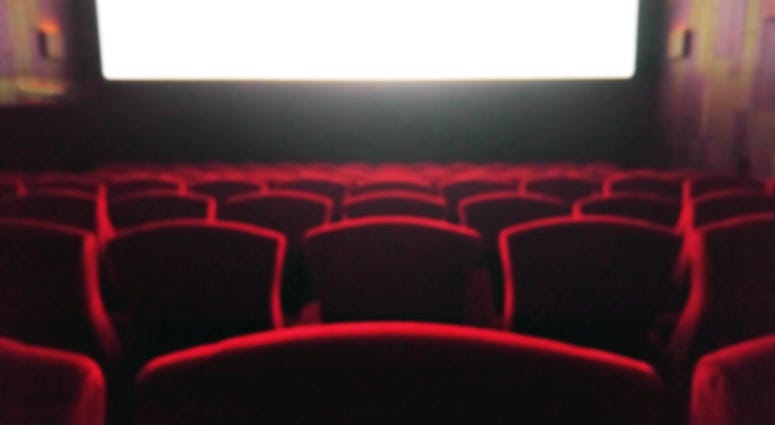 Blur Movie Theater with Red Chairs