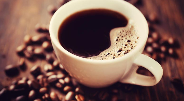 coffee Coffee cup and beans, on wooden table