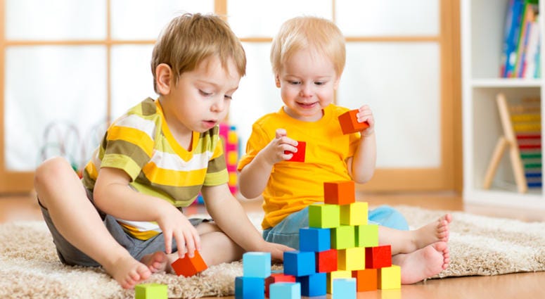 kids playing Kids playing block toys in playroom at nursery