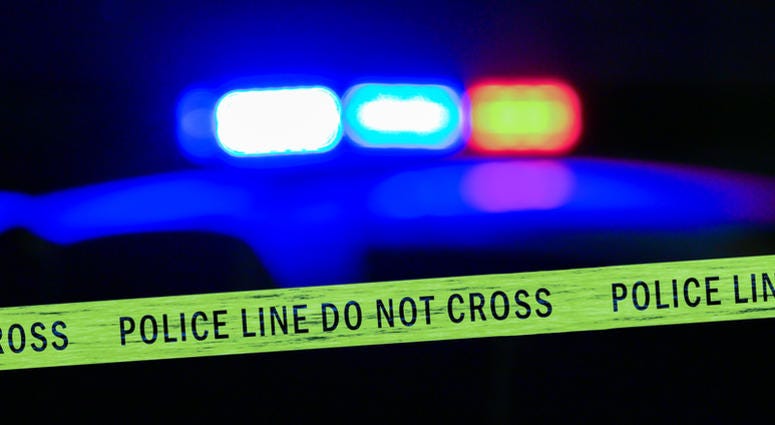 Police lights police lights shine behind crime scene tape