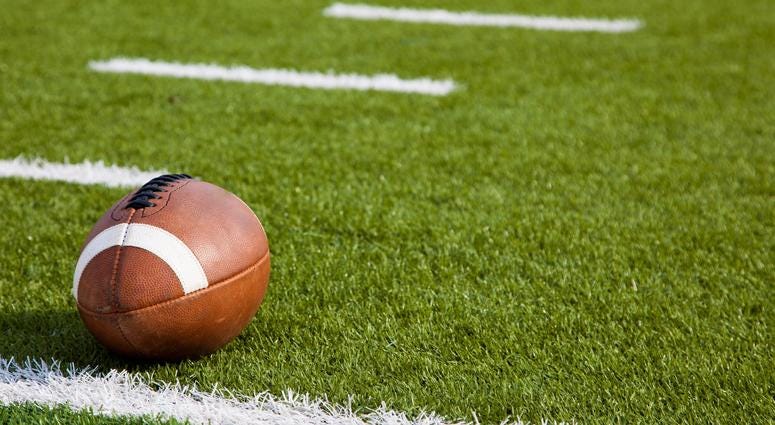 Football near the yardage line of a football field Football near the yardage line of a football field