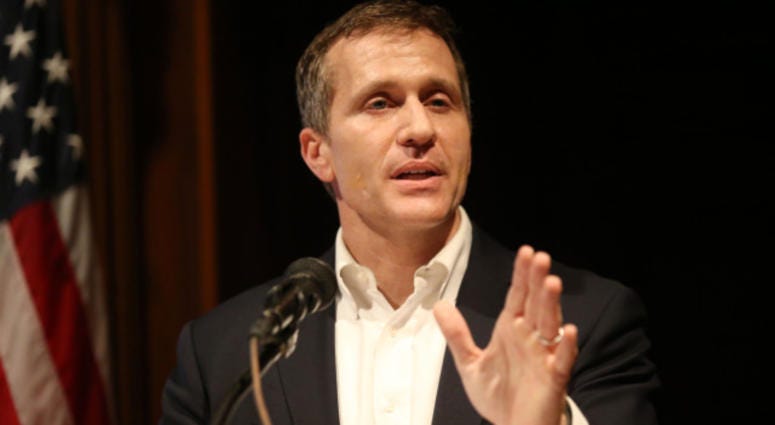 Missouri Governor Eric Greitens tells a reporter that all questions have been answered on his affair as he tries to talk about a new state budget during a press conference at the State Capitol in Jefferson City, Missouri on January 22, 2018. Greitens, who