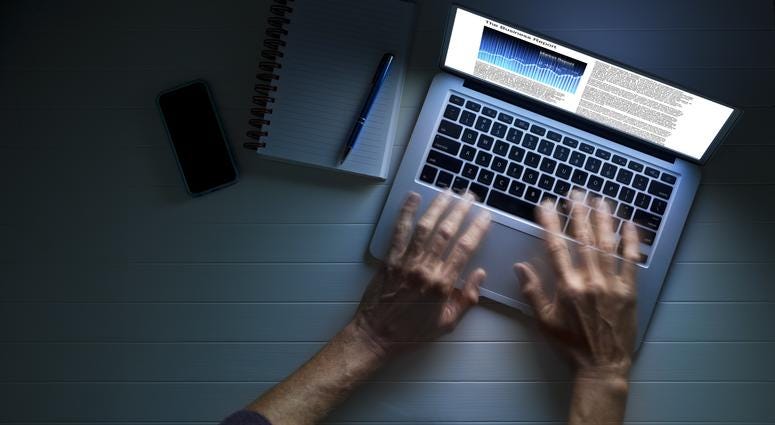 Man uses a laptop computer. Man uses a laptop computer.