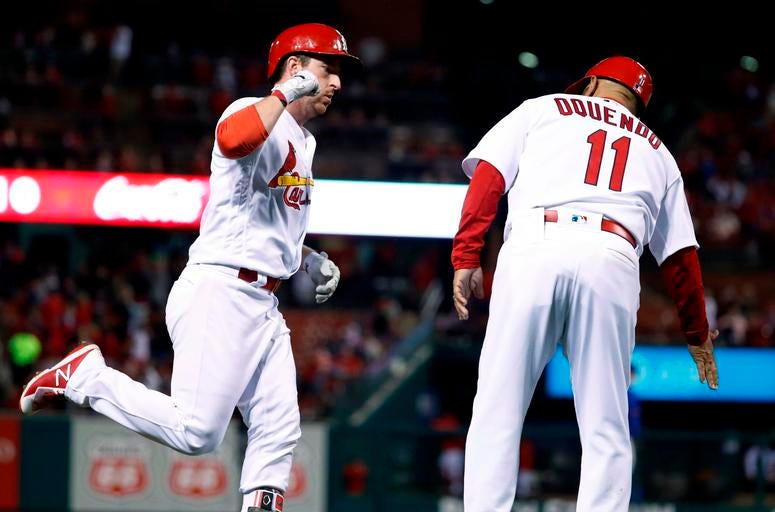 St. Louis Cardinals' Jedd Gyorko, left, is congratulated by third base coach Jose Oquendo after hitting a solo home run St. Louis Cardinals' Jedd Gyorko, left, is congratulated by third base coach Jose Oquendo after hitting a solo home run
