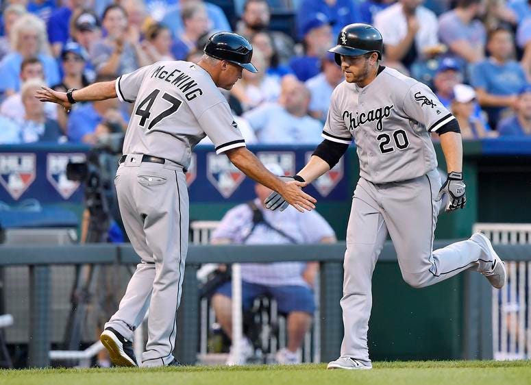 Chicago White Sox third baseman Todd Frazier (right) celebrates his two run home run with third base coach Joe McEwing Chicago White Sox third baseman Todd Frazier (right) celebrates his two run home run with third base coach Joe McEwing
