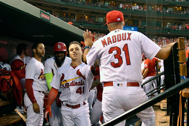 St. Louis Cardinals right fielder Tyler O'Neill (41) is congratulated by pitching coach Mike Maddux. St. Louis Cardinals right fielder Tyler O'Neill (41) is congratulated by pitching coach Mike Maddux.