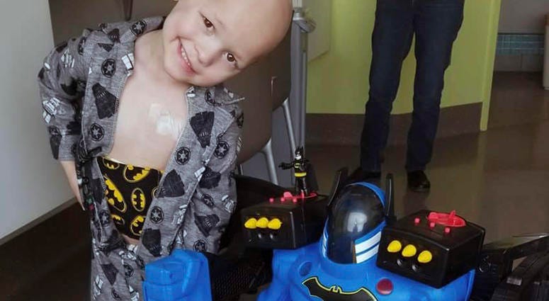 This undated photo provided by Emilie Matthias shows a photo of her son Garrett Matthias in a hospital as he receives treatment for a rare cancer in Iowa City, Iowa.