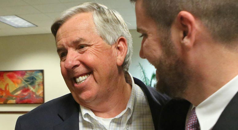 Mike Parson, left, celebrates his election as Lieutenant Governor of Missouri, on November 8, 2016, at the Oasis Convention Center in Springfield, Mo.