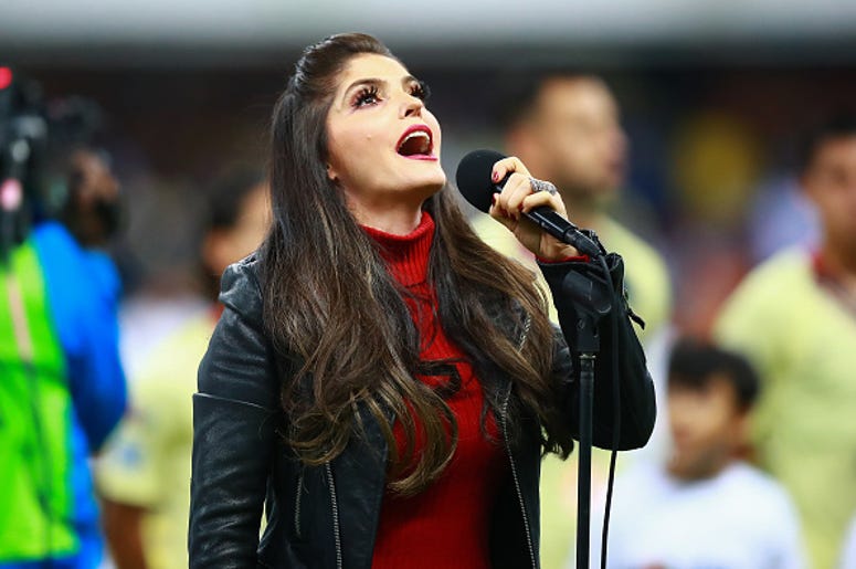 Ana Bárbara Llora En Rueda De Prensa Singer Ana Barbara sings the national anthem of Mexico during the final first leg match between America and Cruz Azul as part of the Torneo Apertura 2018 Liga MX at Azteca Stadium on December 13, 2018 in Mexico City, Mexico.