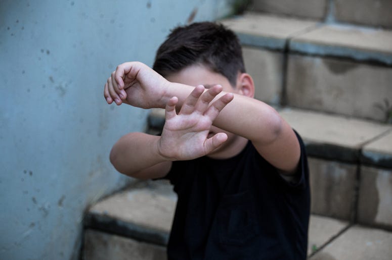 “Ley Anti-Chancla” Defiende Niños De Sinaloa A little boy protects himself with his palms and covers his face. Stop abusing boy violence. violence, terrified , A fearful child