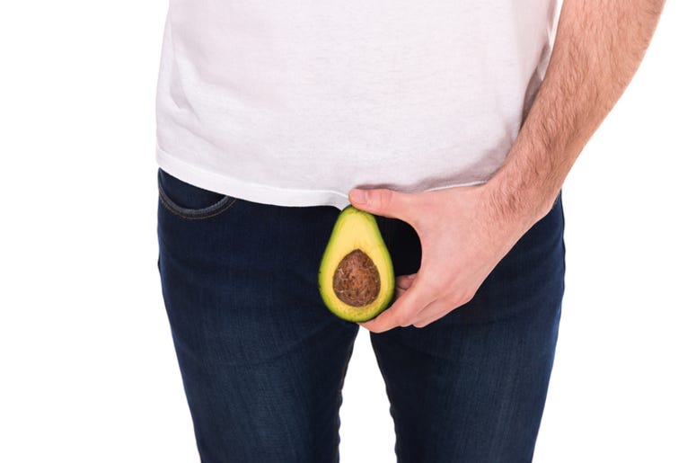 Un Hombre Asaltó Dos Bancos Con Un Aguacate Man is holding avocado, isolated on white background.