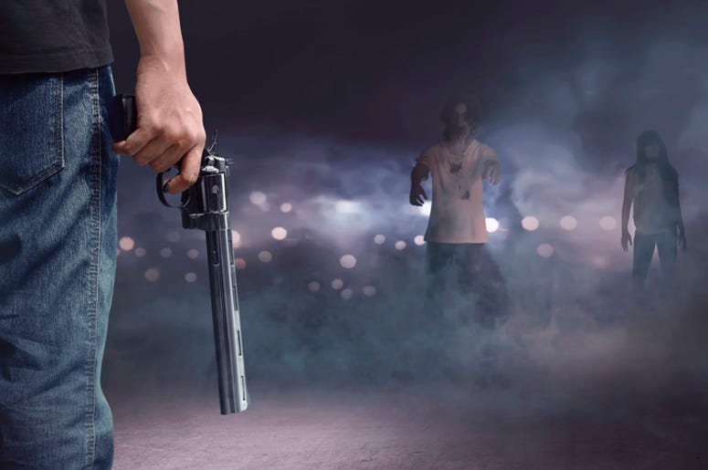 “Soy Inocente”, Dice El Sospechoso De La Balacera En La Fiesta De Greenville Brave man with jeans pants holding gun looking at zombies walking into him