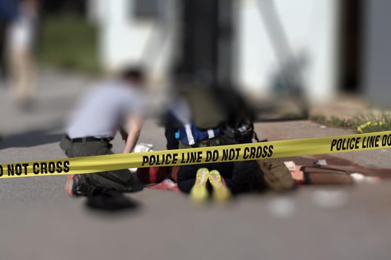Dos Personas Balaceadas En Las Oficinas Centrales De YouTube Police line cross with blurred medic law enforcement background in active shooter scenario and medical evacuation training scenario with copy space