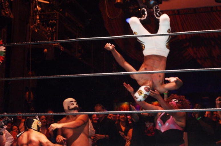 Hospitalizan A La Parka Por Golpazo En La Cabeza Luchadores, traditional Mexican wrestlers, fly over the ropes and into the audience as they perform at the Lucha Vavoom Cinco de Mayan! show at the Mayan Theater on Cinco de Mayo, May 5, 2009 in Los Angeles, California. Lucha Vavoom combines elements of t