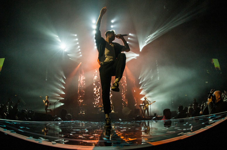 Dan Reynolds of Imagine Dragons performs live on stage at the Genting Arena in Birmingham Dan Reynolds of Imagine Dragons performs live on stage at the Genting Arena in Birmingham